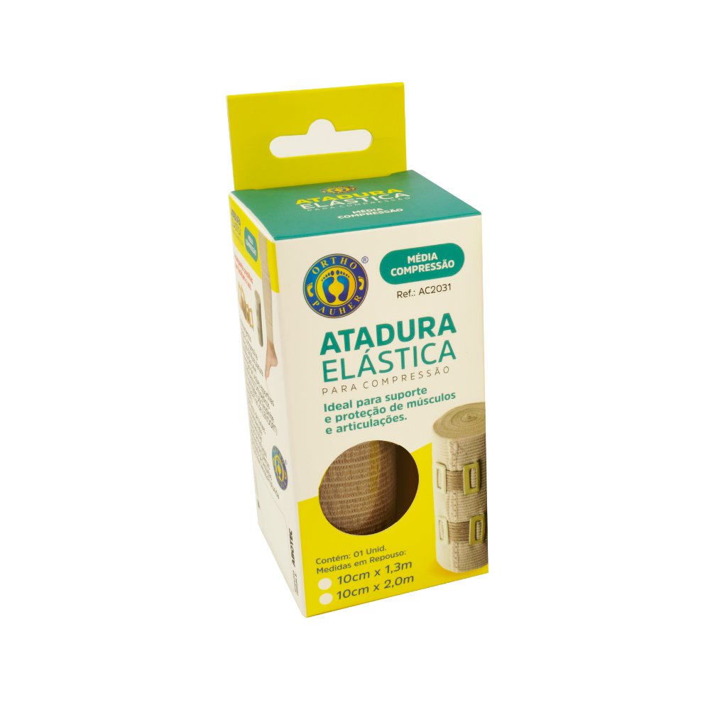 Embalagem da atadura elástica, a caixa tem a parte de cima dela verde com a identificação de média compressão. Na parte frontal tem uma abertura em circulo onde é possivel ver a cor e textura da atadura.