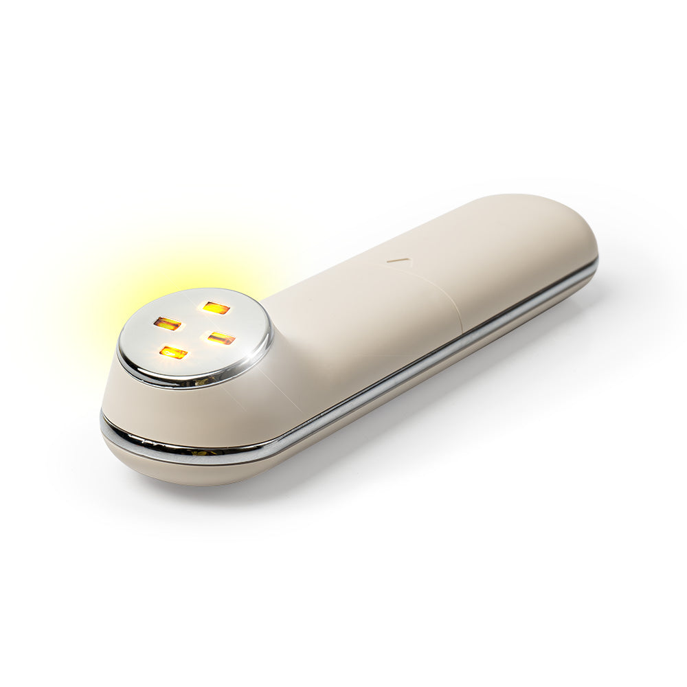 A imagem mostra o Glow Skin massageador facial estático ligado virado para cima